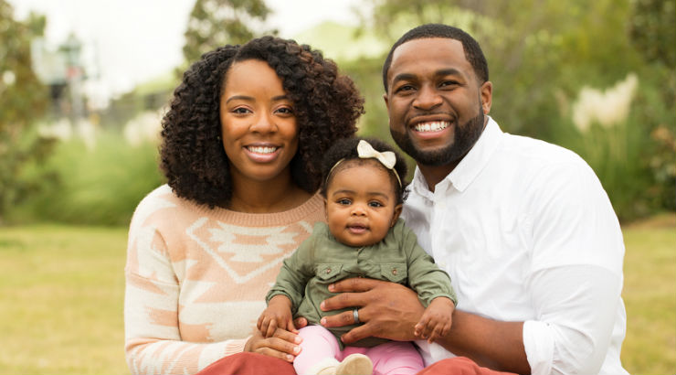 happy family with adopted african baby